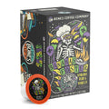 The front of the Bones Coffee Company Bananas Foster 12 Count Bones Cups box. Its flavor is banana, rum, and vanilla, and it has a skeleton wearing a chef’s hat and mardi gras glasses with balloons with the New Orleans emblem on the art.