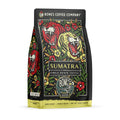 The front of a 12 ounce bag of Bones Coffee Company Sumatra single-origin coffee. It is a dark roast, and it has one red and one yellow tiger with flowers scattered around them on the art.